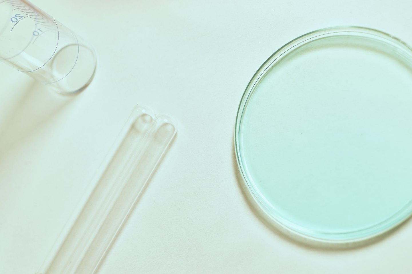 Laboratory glassware with a light blue liquid.